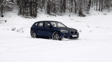 BMW keeping distance on snowy road