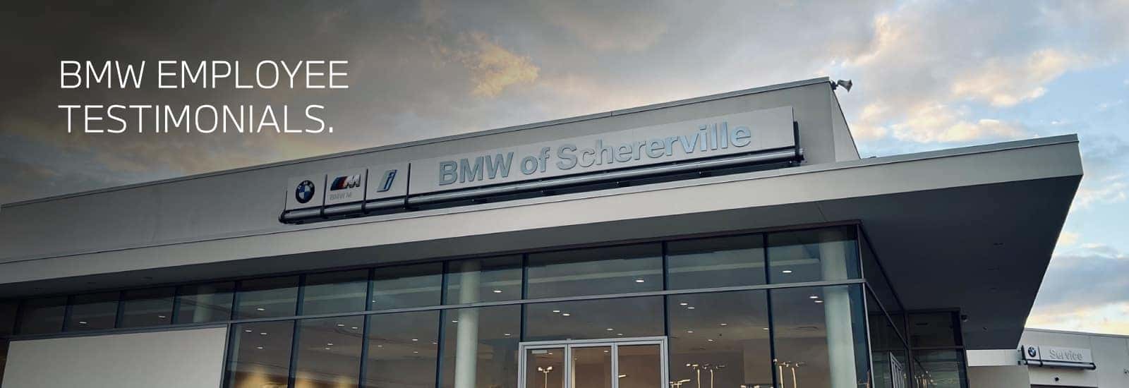 Image of the BMW of Schererville Dealership with a cloudy sky, white text says 'EMPLOYEE TESTIMONIALS' on top