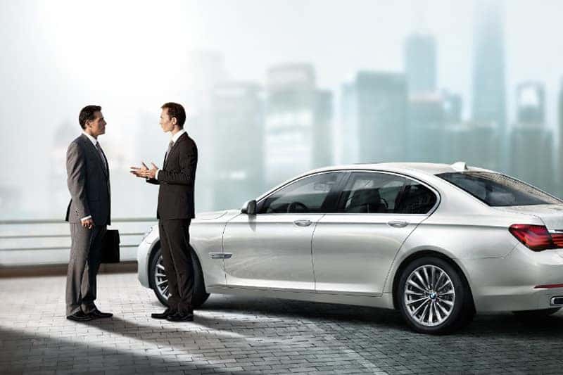 Image of the interior of a BMW vehicle, displaying the tech features of a dashboard.