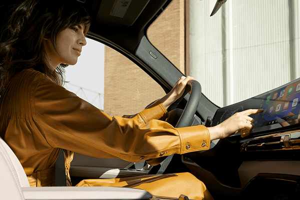 Driver using 2025 BMW X1 touchscreen display