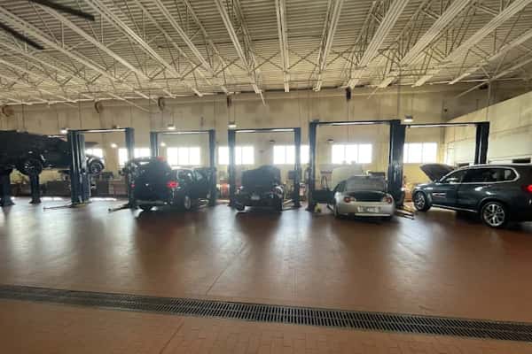 BMW certified technician working on vehicle