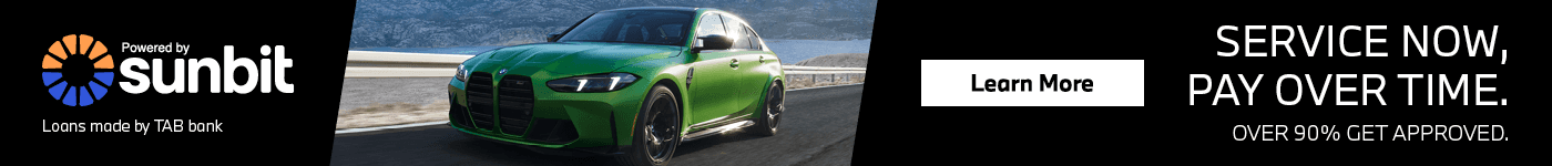 Green BMW Driving - Sunbit Financing 