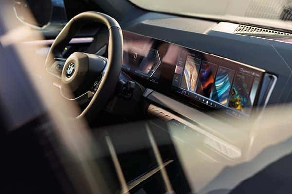 Close-up of a BMW's curved digital dashboard display