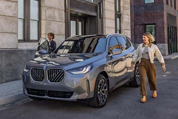 Gray BMW SUV parked on a city street