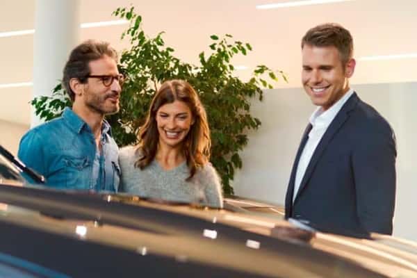 Customers being greeted by a BMW of Schererville sales associate in the showroom