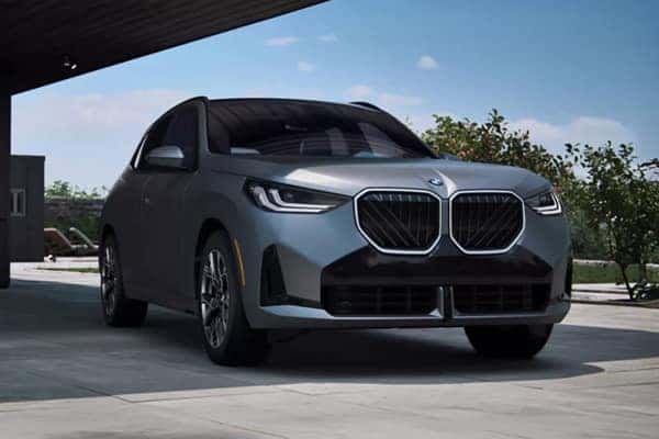 BMW X3 parked under a covered structure