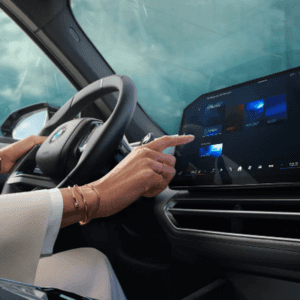 2027 BMW X5 driver's view of the steering wheel and dashboard