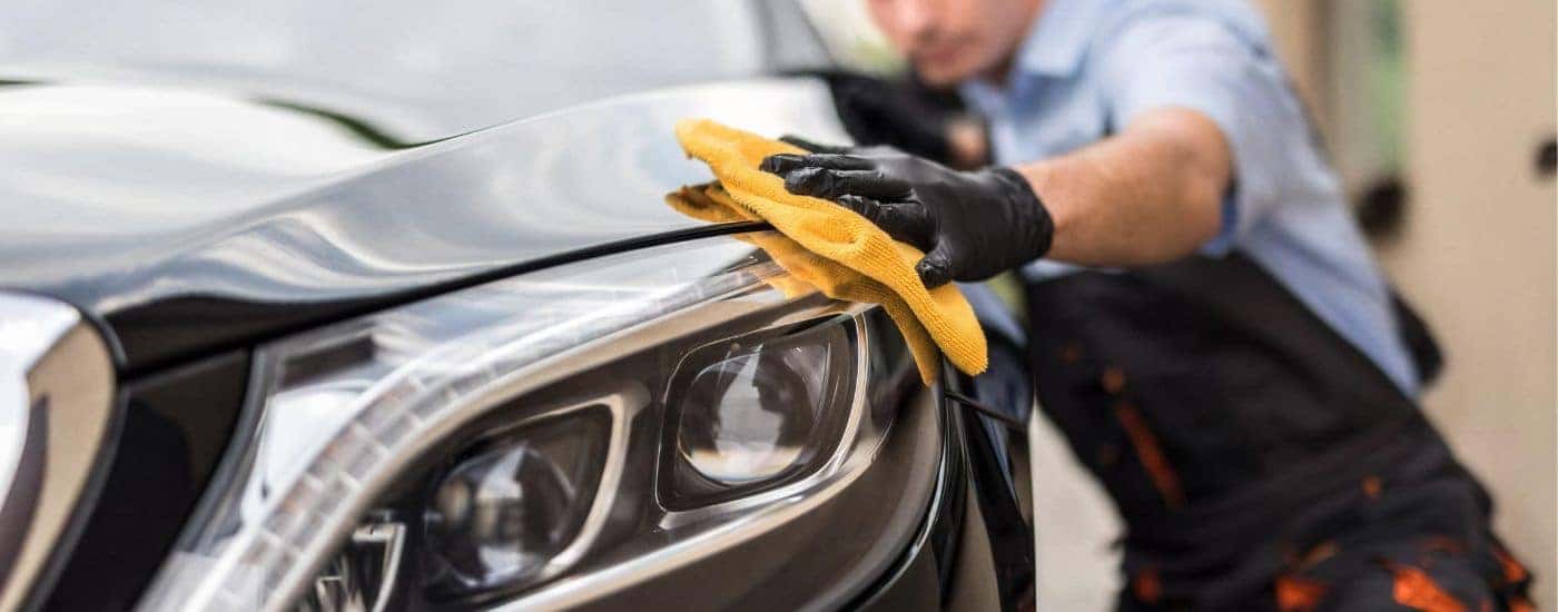 Maintenance being performed on a vehicle.