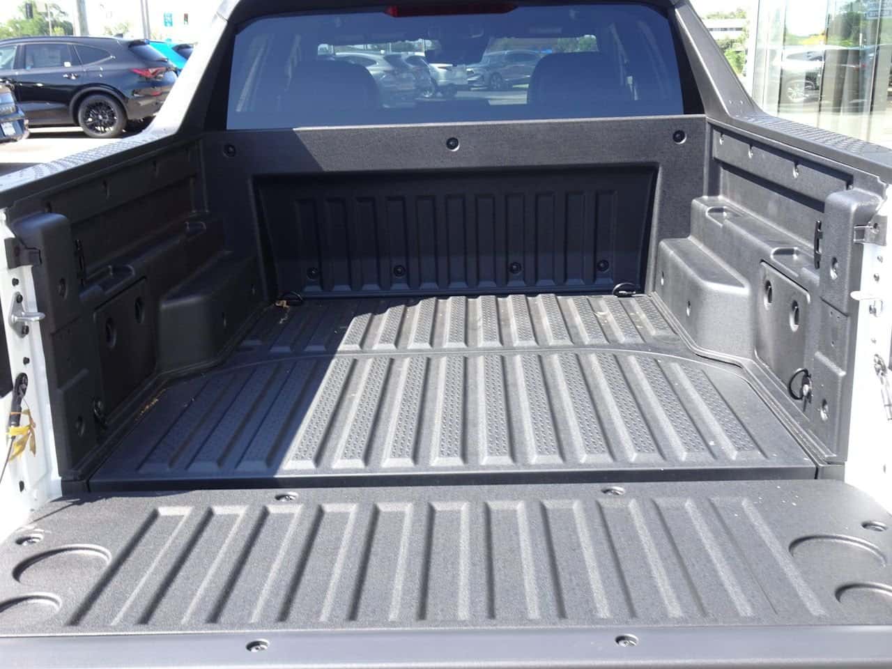 Open truck bed with the tailgate lowered on a 2026 Hyundai Santa Cruz at Columbia Hyundai in Cincinnati