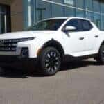 White 2026 Hyundai Santa Cruz parked outside the Columbia Hyundai showroom in Cincinnati