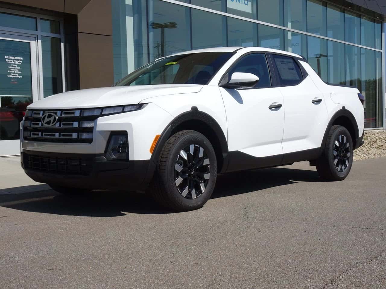 White 2026 Hyundai Santa Cruz parked outside the Columbia Hyundai showroom in Cincinnati