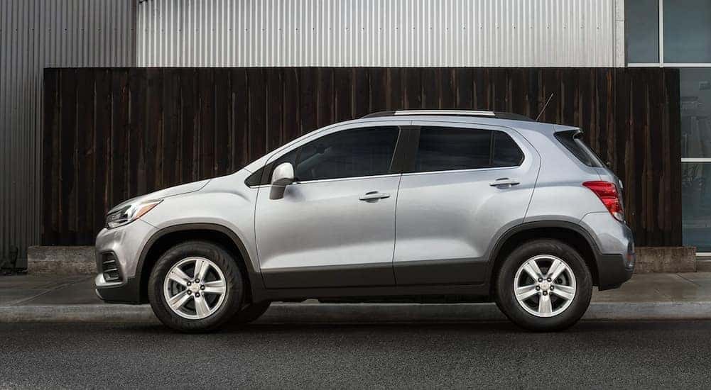 A silver 2021 Chevy Trax is shown parked on a city street.