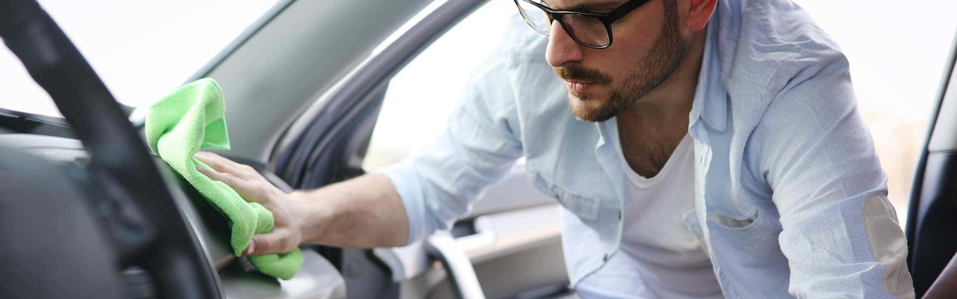 Tips for spring cleaning your car at Halterman's Toyota in East Stroudsburg | Man Washing Interior of Vehicle