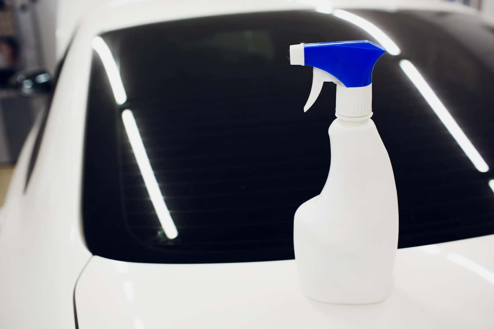 How to prepare your Toyota for the winter season at Halterman's Toyota in East Stroudsburg, PA | Bottle of wiper fluid sitting on car
