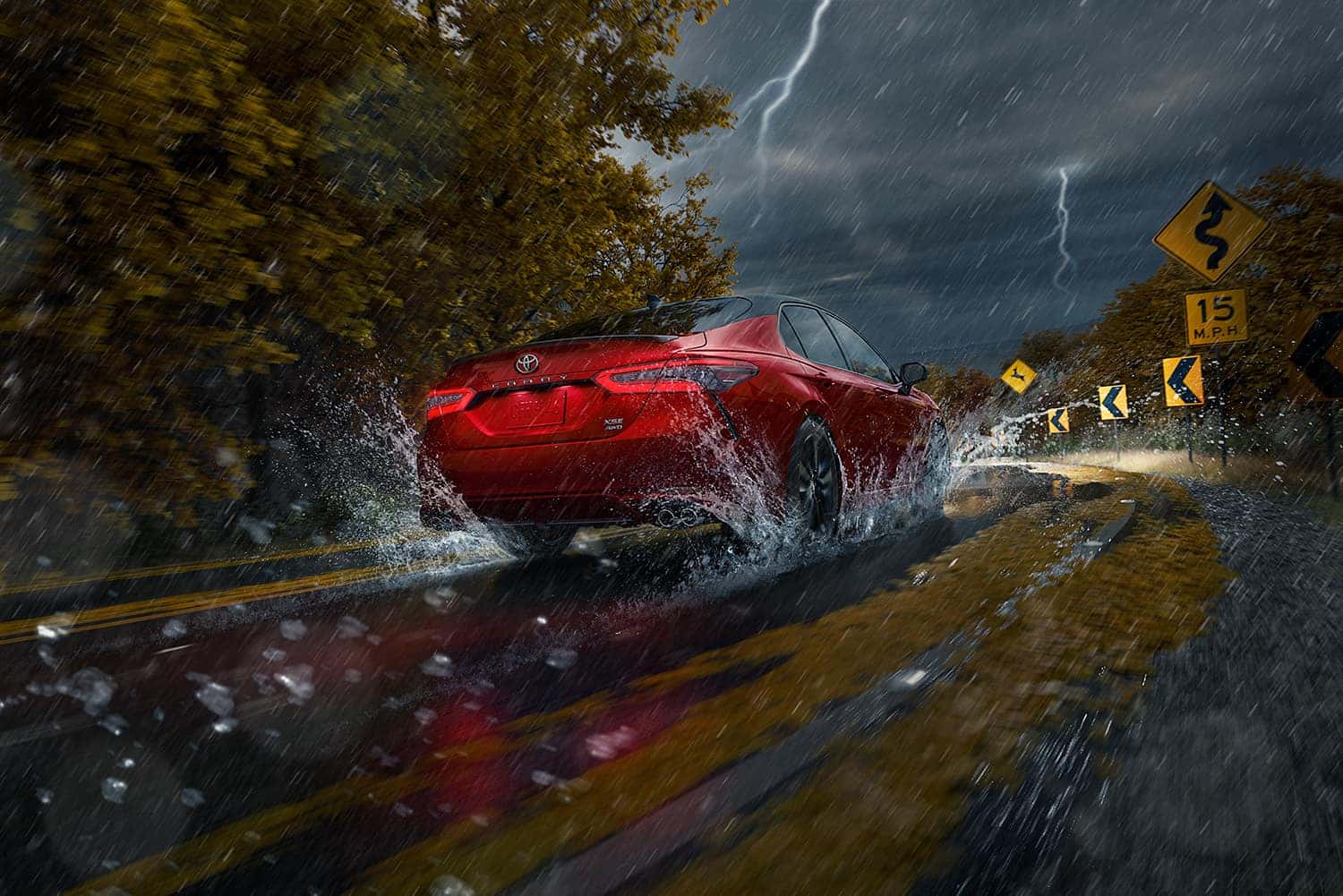 Accessories that help keep your Toyota protected at Halterman's Toyota in East Stroudsburg | 2021 Toyota Camry driving through wet roads in the rain
