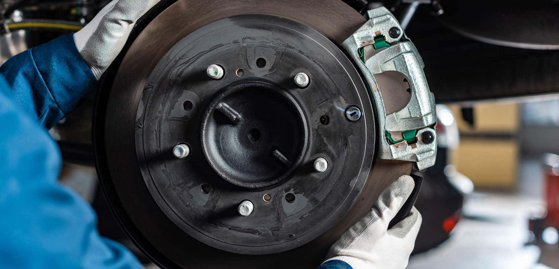 Brake replacement and Safety at Halterman's Toyota of East Stroudsburg | Service Technician Working on Brakes on Vehicle
