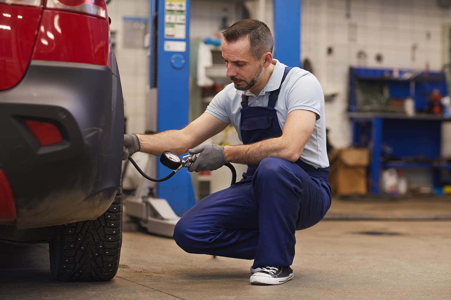 How to check your tires' health at Halterman's Toyota of East Stroudsburg | Mechanic checking tire pressure