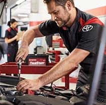 Everything You Need to Know about Your Car Battery at Halterman's Toyota | Mechanic puts in battery