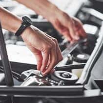 Everything You Need to Know about Your Car Battery at Halterman's Toyota | Putting engine bay bracket back in