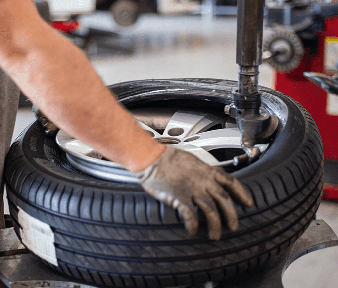 How to Get Your Car Summer Ready at Halterman's Toyota in East Stroudsburg, PA | New tires being installed by mechanic using tire machine