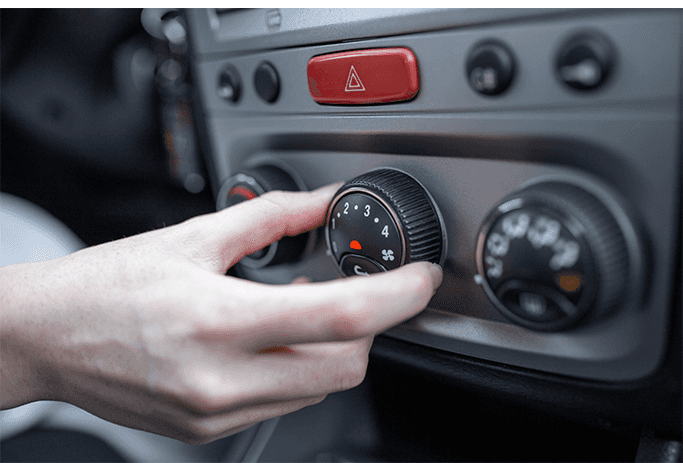 How to Get Your Car Summer Ready at Halterman's Toyota in East Stroudsburg, PA | Person turning the knob of A/C pressure in the car