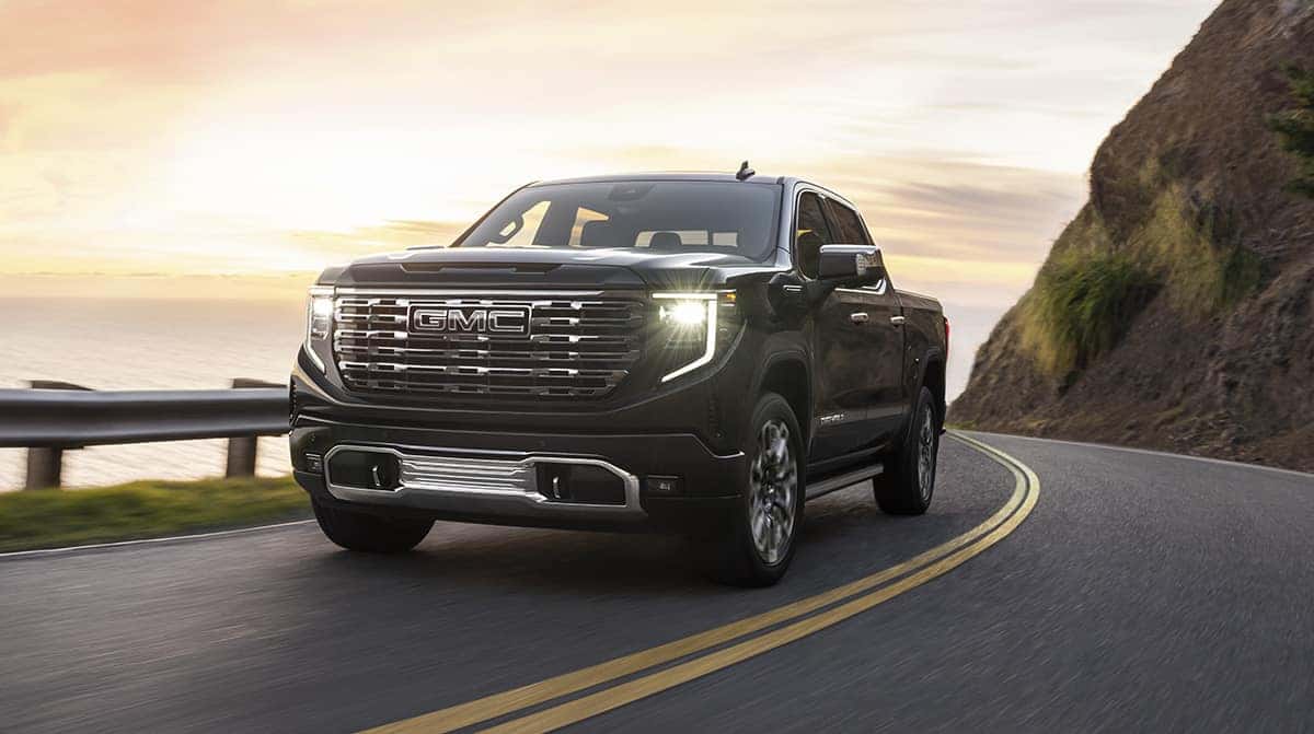 2026 GMC Sierra 1500 Crew Cab 4x4 exterior profile overlooking mountain valley