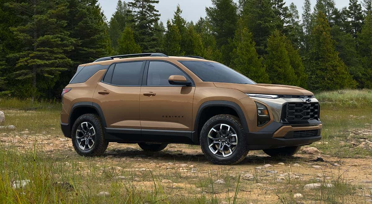 2027 Chevrolet Equinox ACTIV AWD exterior three-quarter view in meadow setting