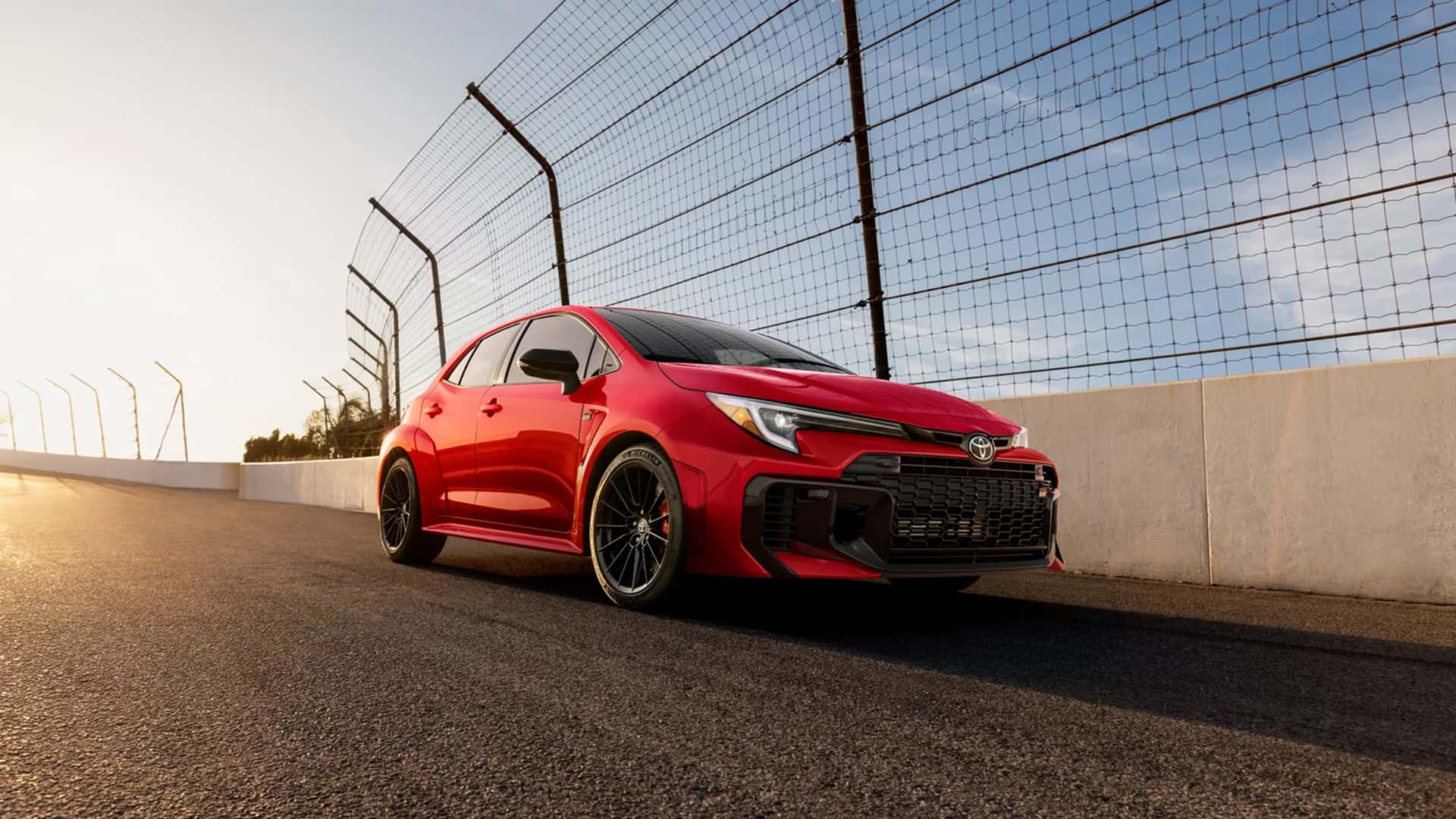2025 red GR corolla on road