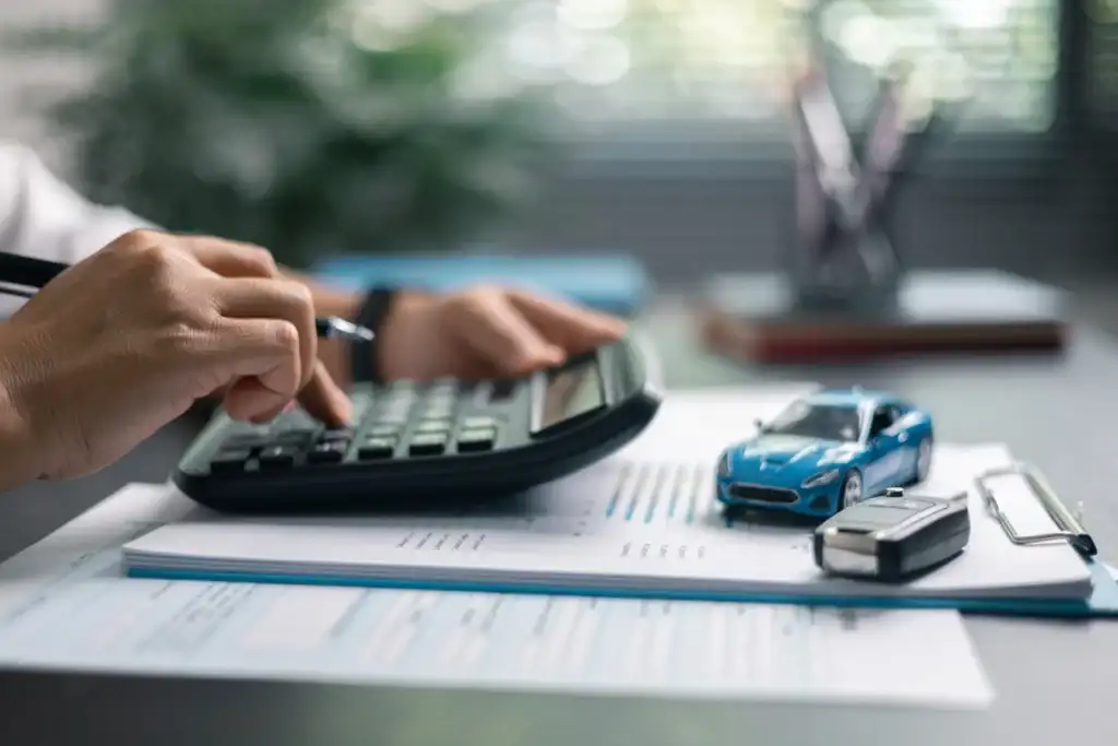Person calculating loan budget NewPortMotors