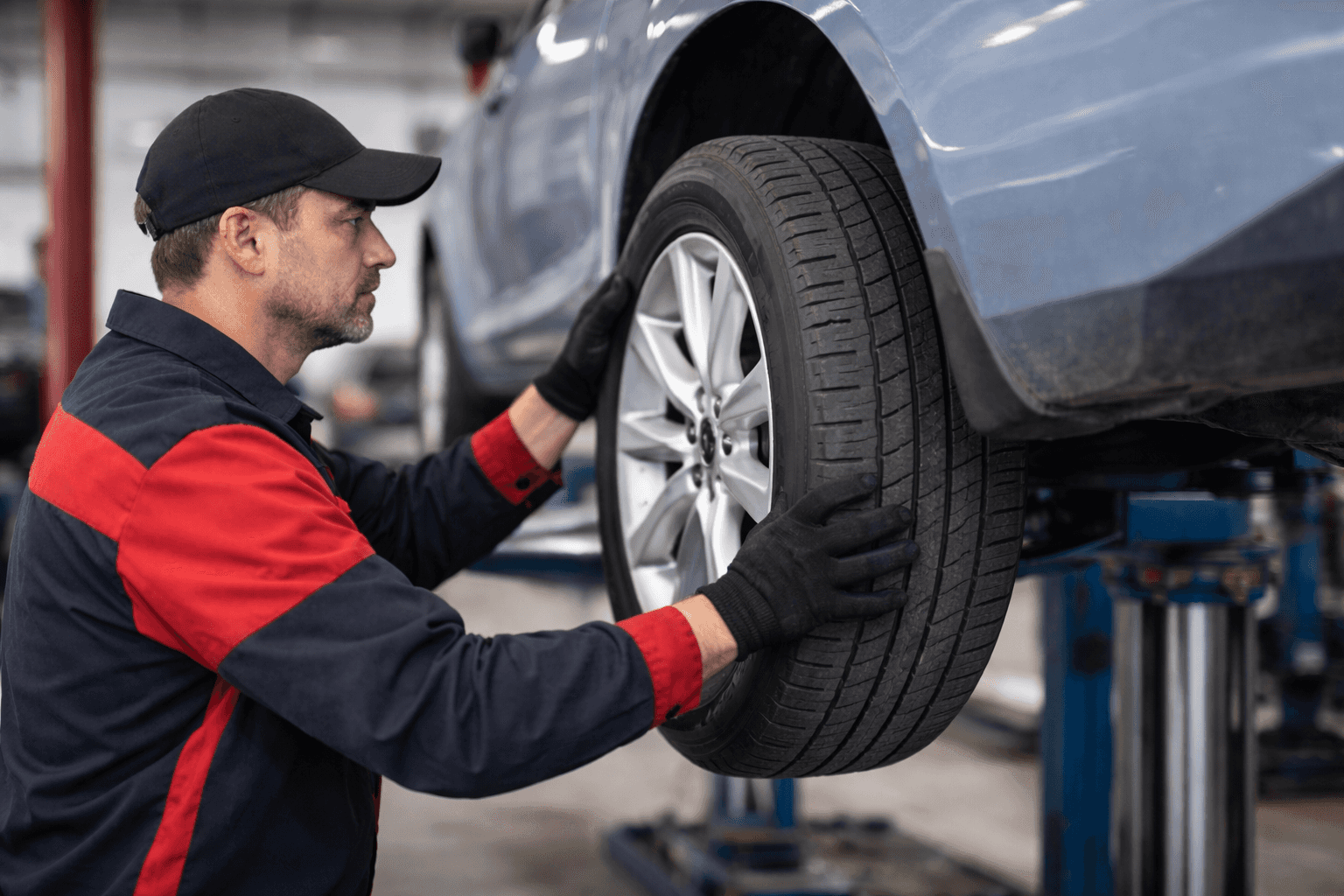Technician putting on a brand new tire on a car in North Olmsted Ohio