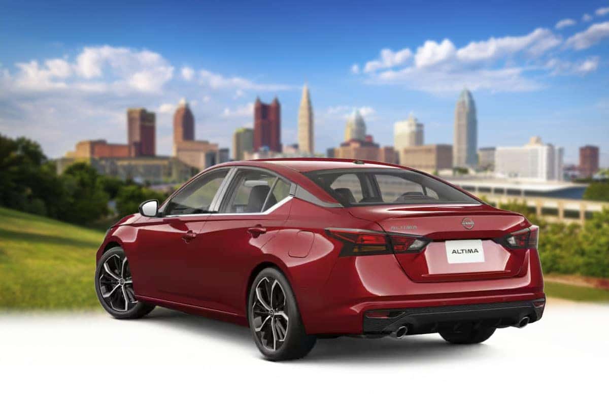 Rear three-quarter view of a 2026 Nissan Altima in Scarlet Ember Tintcoat red