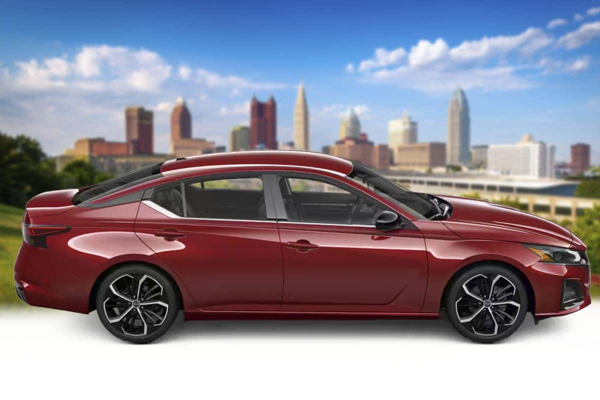 Side profile view of a 2026 Nissan Altima in Scarlet Ember Tintcoat red