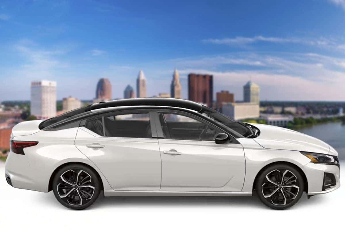 Side profile view of a 2026 Nissan Altima in Two-Tone Pearl White TriCoat showing the contrasting roof