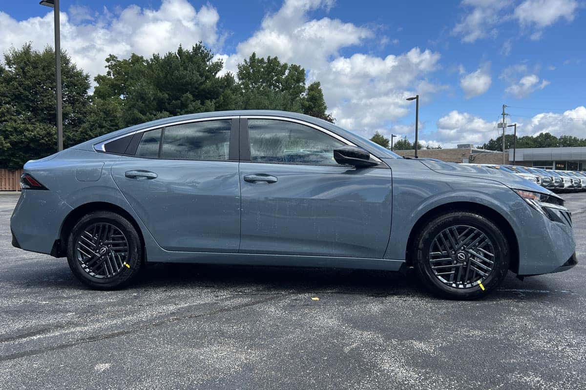 2027 Nissan Sentra Atlantic Gray Metallic exterior color driver side rear three-quarter exterior view near cleveland ohio