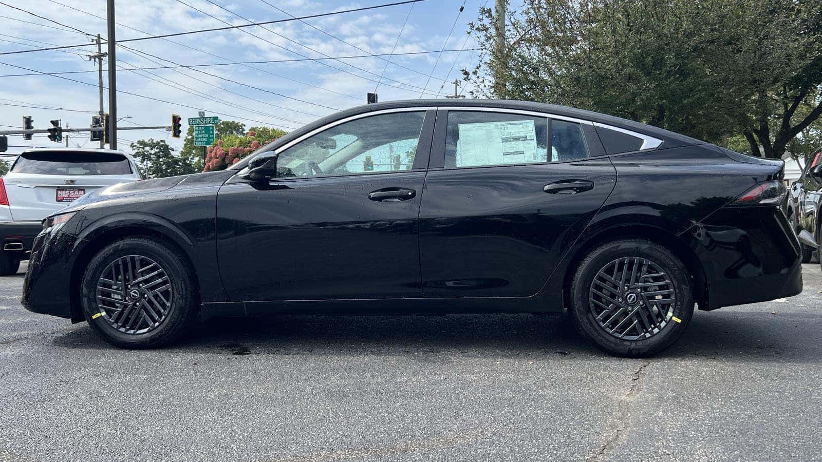 2027 Nissan Sentra Black exterior color driver side view near Cleveland, Ohio