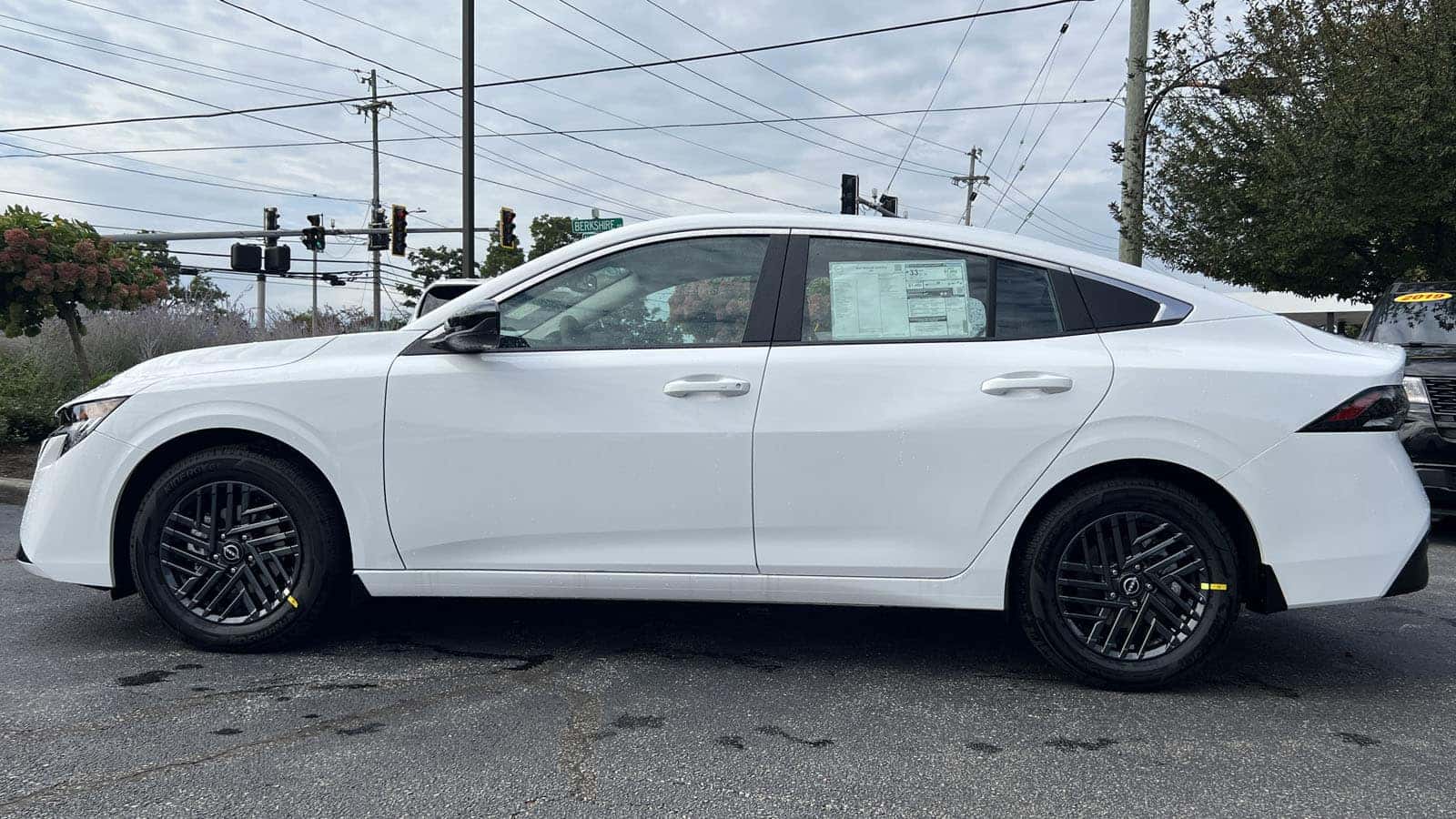 2027 Nissan Sentra Fresh Powder exterior color driver side exterior view near Cleveland, Ohio