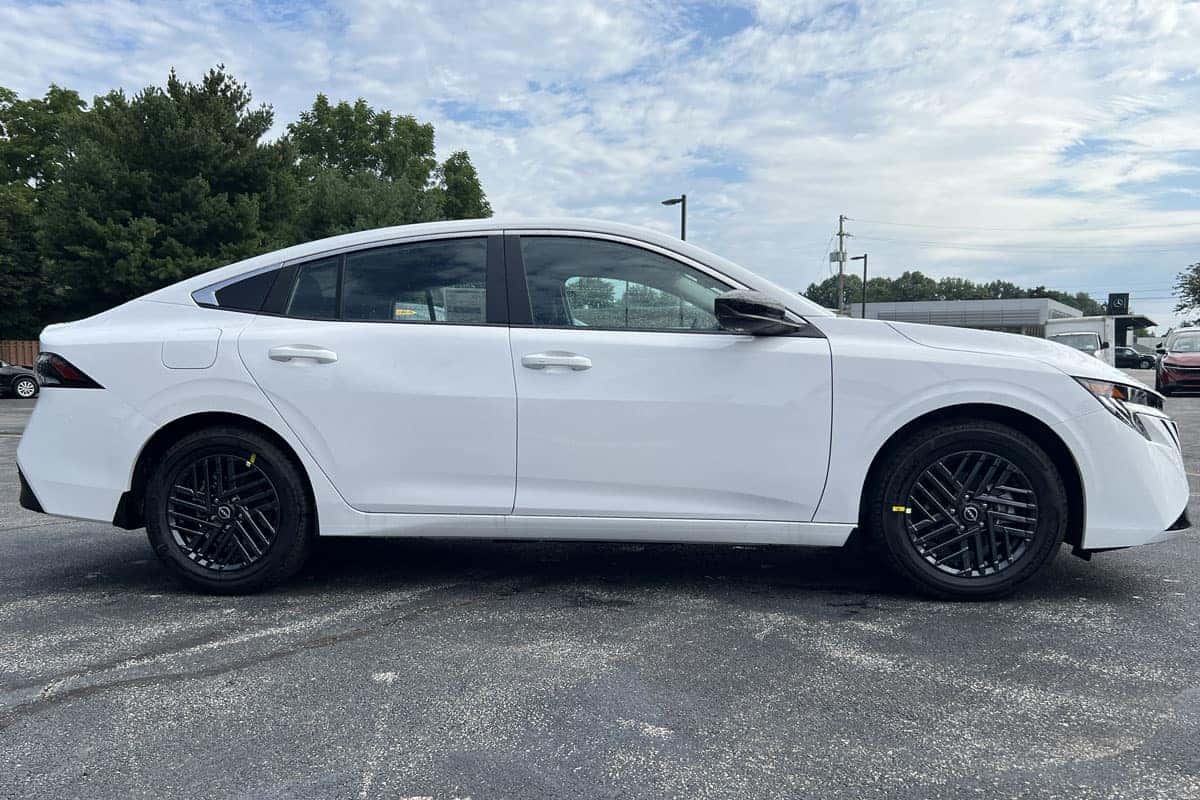 2027 Nissan Sentra Fresh Powder exterior color passenger side view near Cleveland, Ohio