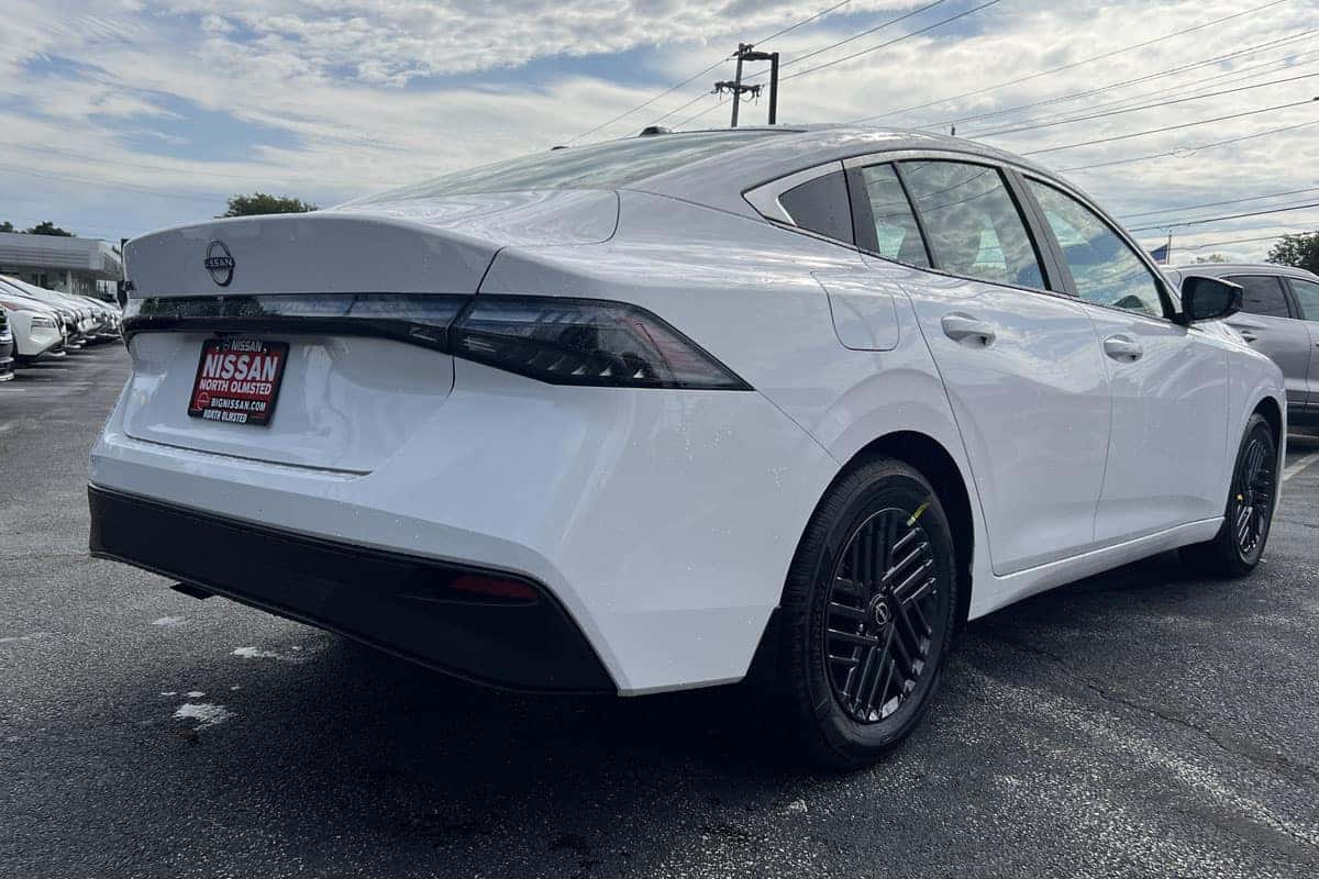 2027 Nissan Sentra Fresh Powder exterior color rear three-quarter exterior view near Cleveland, Ohio