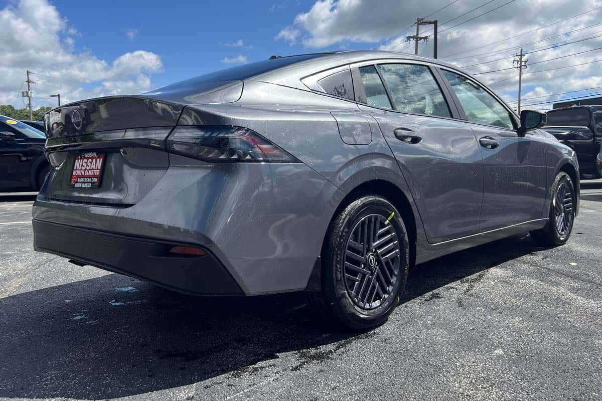 2027 Nissan Sentra Gun Metallic rear three-quarter exterior view