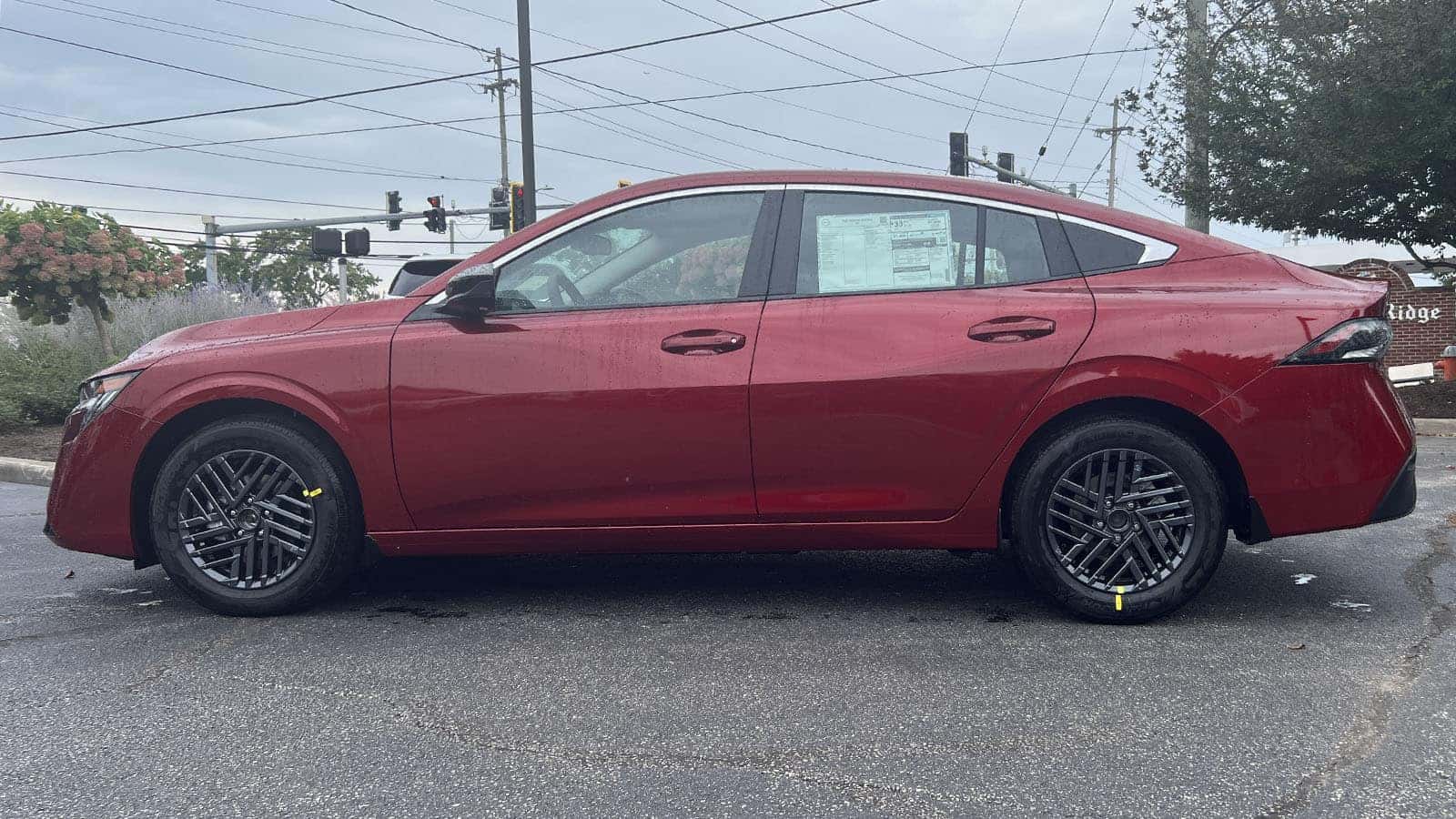 2027 Nissan Sentra Scarlet Ember Red driver side exterior view near Cleveland, Ohio