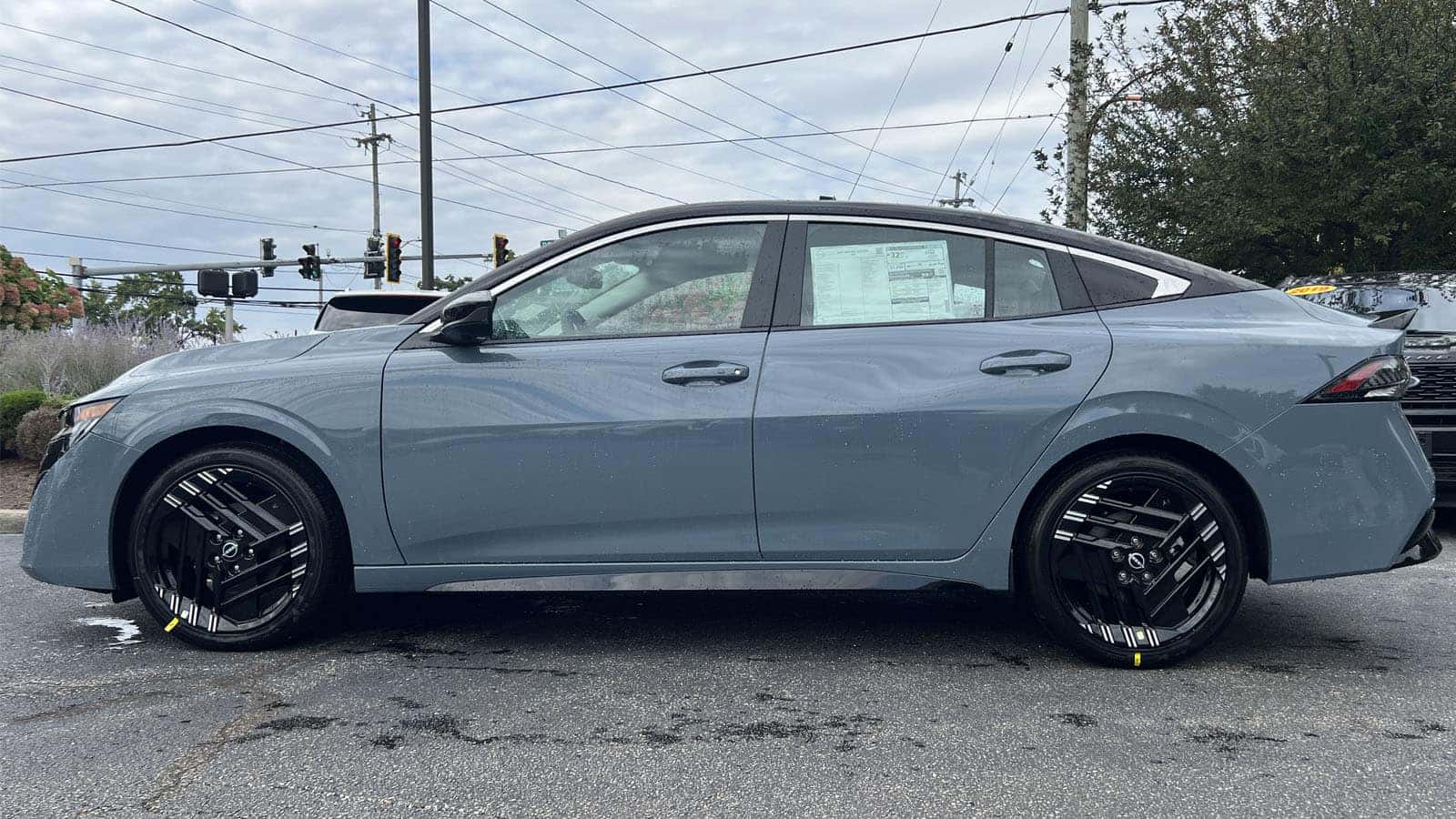 2027 Nissan Sentra Two-Tone Atlantic Gray Metallic with Black Roof driver side exterior view near Cleveland, Ohio