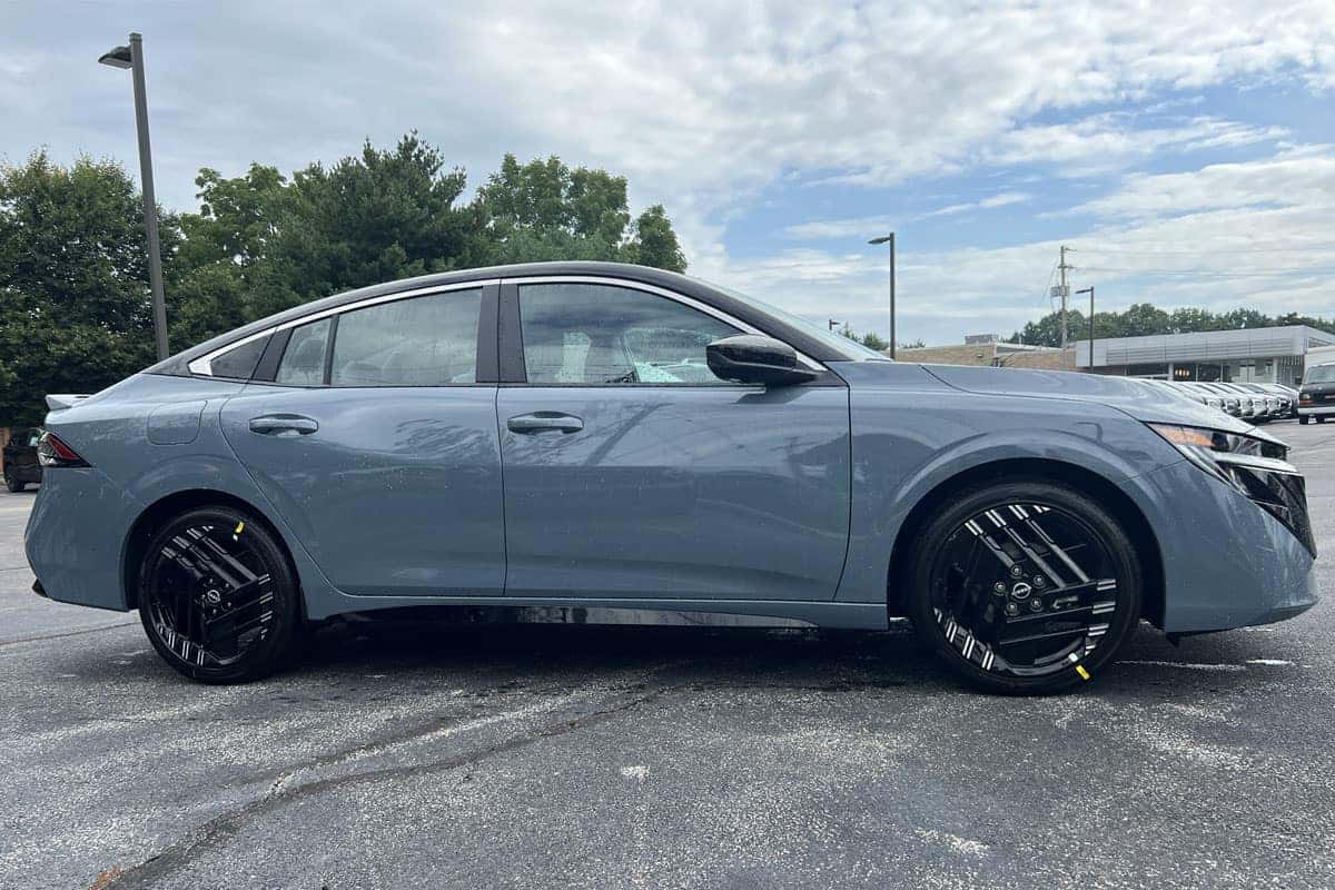 2027 Nissan Sentra Two-Tone Atlantic Gray Metallic with Black Roof exterior color passenger side view near Cleveland, Ohio