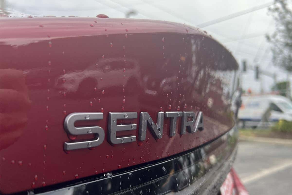 Close-up of the 2027 Nissan Sentra Scarlet Ember Red exterior color near Cleveland, Ohio