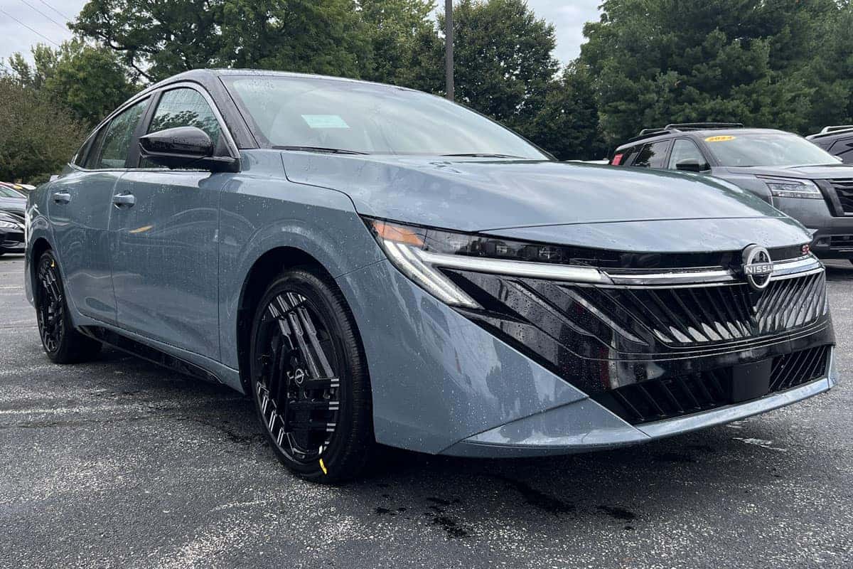 Front passenger side view of the 2027 Nissan Sentra Two-Tone Atlantic Gray Metallic with Black Roof exterior color near Cleveland, Ohio