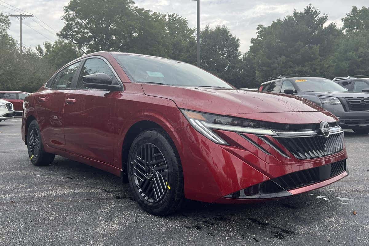 Front three-quarter view of the 2027 Sentra in Scarlet Ember Red exterior color near Cleveland, Ohio.