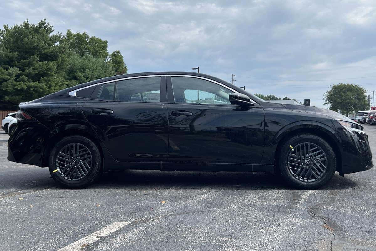 Passenger side view of the 2027 Sentra in Super Black exterior color near Cleveland, Ohio
