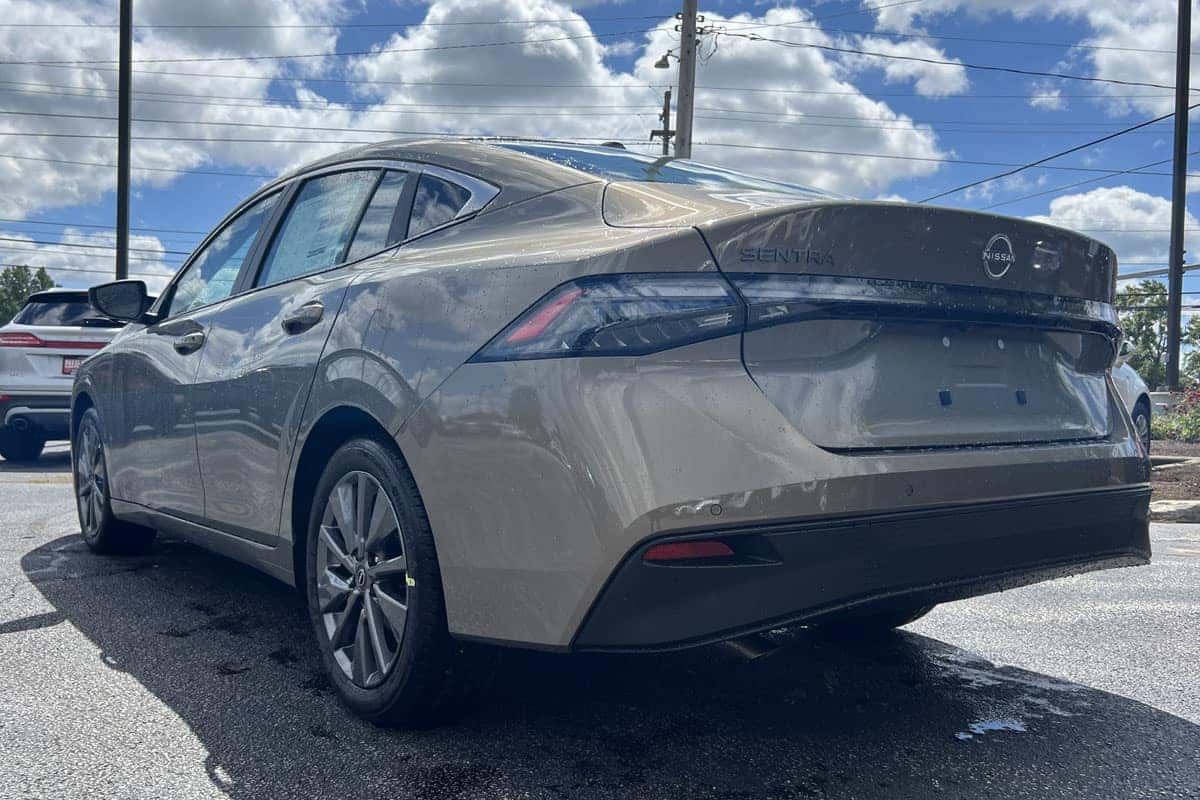 Rear Driver's side view of the 2027 Nissan Sentra Imperial Bronze exterior color