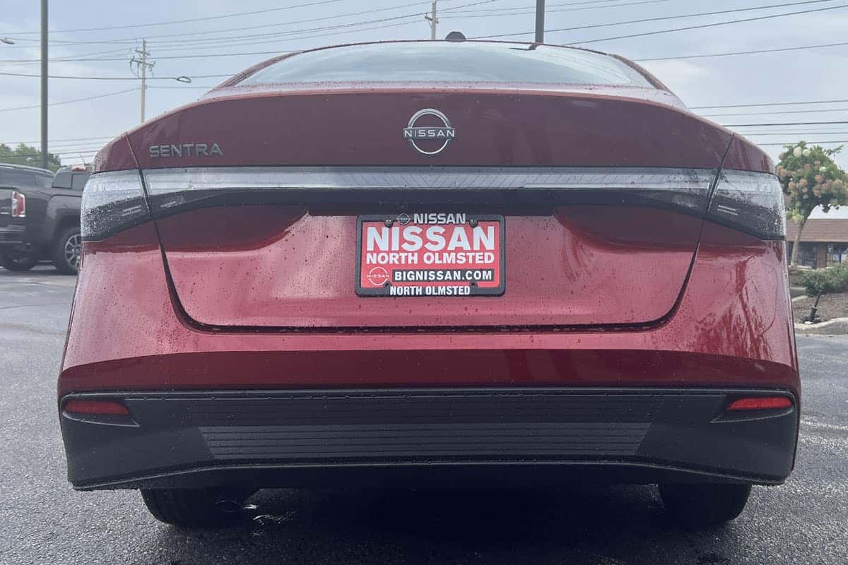 Rear bumper view view of the 2027 Sentra in Scarlet Ember Red exterior color near Cleveland, Ohio