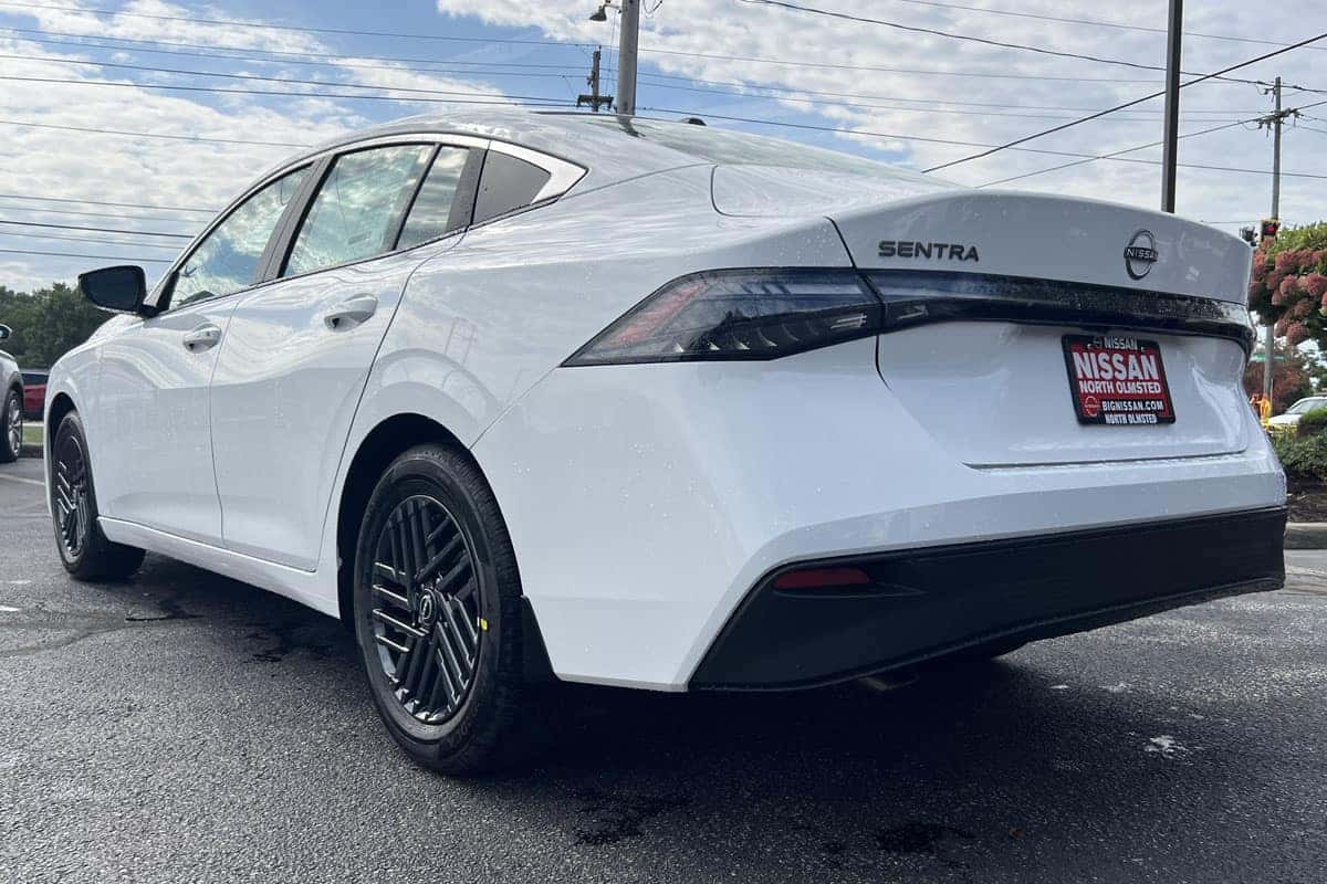 Rear driver's side view of the 2027 Nissan Sentra Fresh Powder exterior color near Cleveland, Ohio