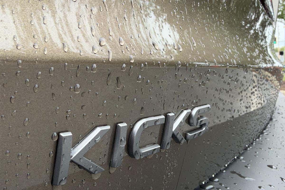 Close up of Kicks logo on the 2027 Nissan Kicks in Canyon Bronze Metallic at Nissan of North Olmsted